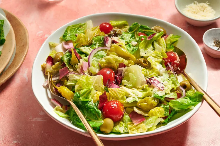 A tossed salad in a serving bowl: the three ingredients
combined